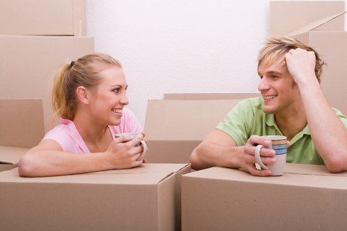 Relocation team setting up furniture in a new office workspace
