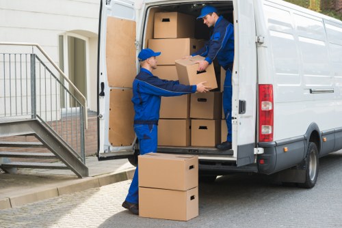 Professional movers planning access on a Bexleyheath street