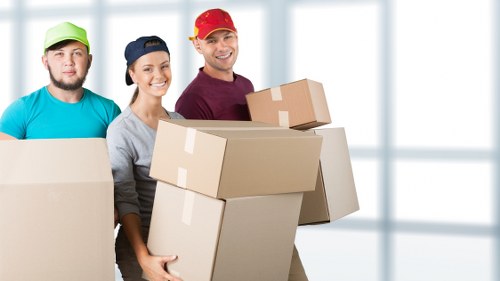 Professional moving team reviewing health and safety standards