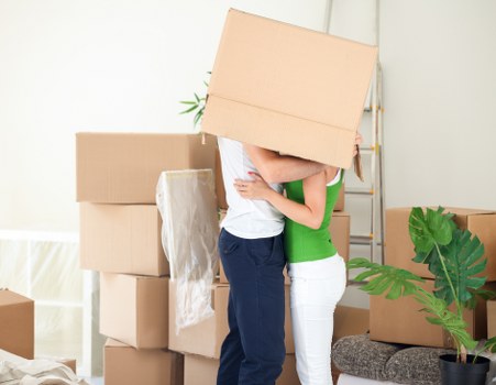 Packed moving boxes and furniture ready for transport in a Bexleyheath home