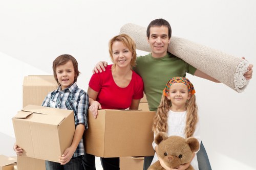 Local removals team handling furniture for a house move in Bexleyheath