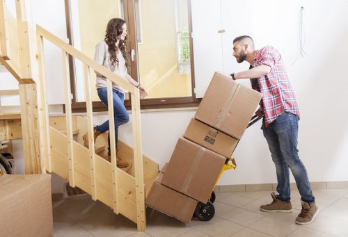Removal team planning a house move in a Bexleyheath street