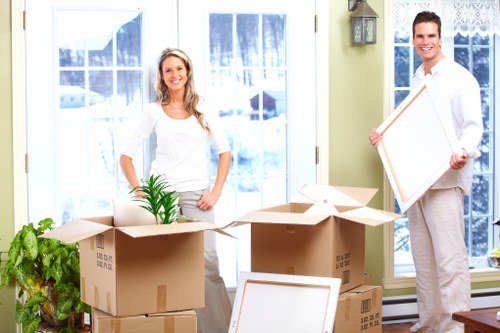 Packed boxes and furniture ready for transport by local movers